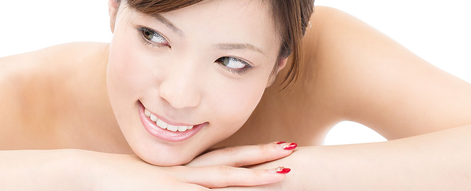 A woman with smooth skin smiles gently