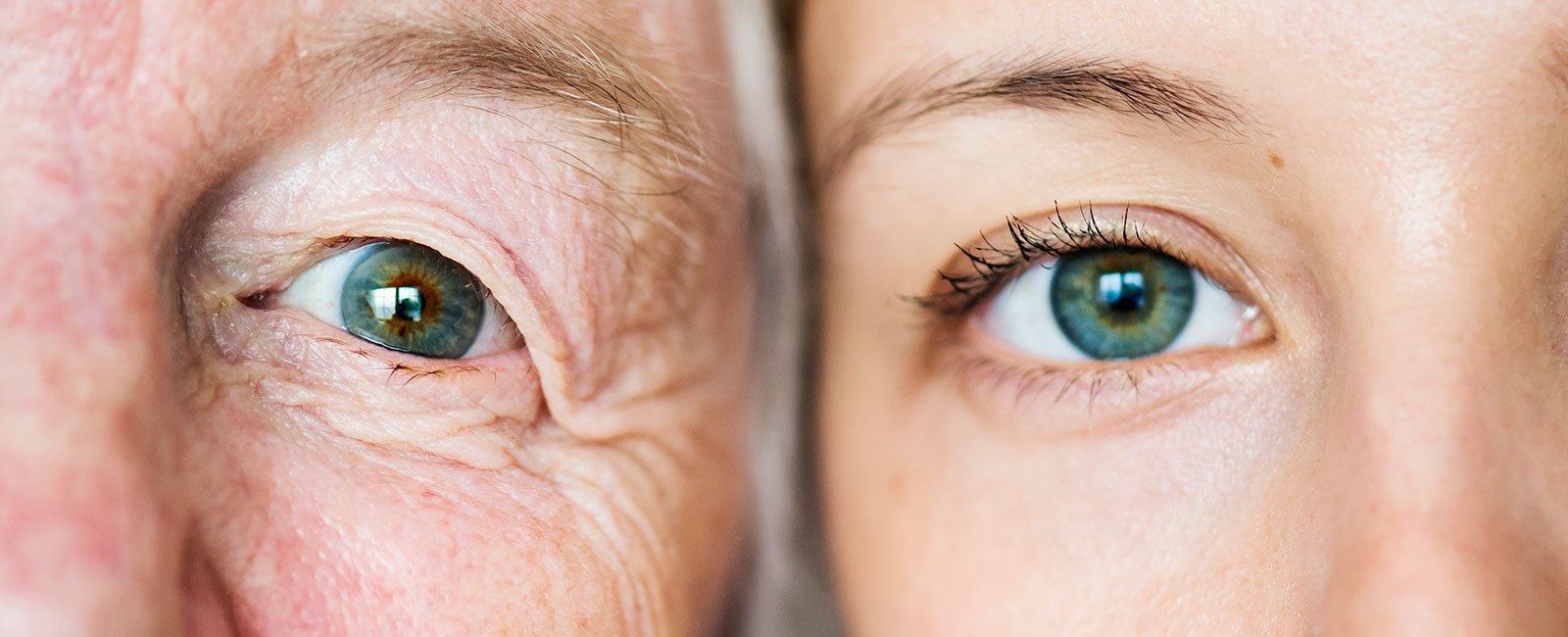 Two blue eyes: one older with wrinkles
